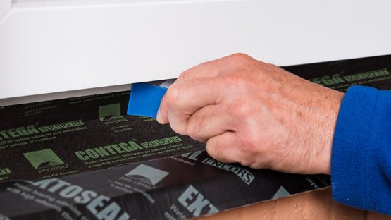 7. Rub to secure the adhesive bond